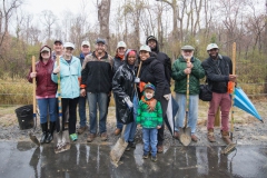 Volunteers plant trees along Phase II of Green Mill Run Greenway during ReLeaf's annual Community Tree Day event on Saturday, March 18, 2017.